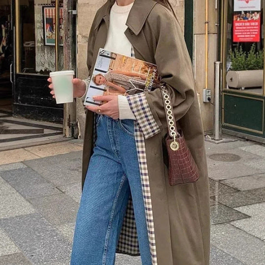 Women's oversized long trench coat with plaid lining by Christine Brewer, featuring a classic, stylish design and tailored fit.