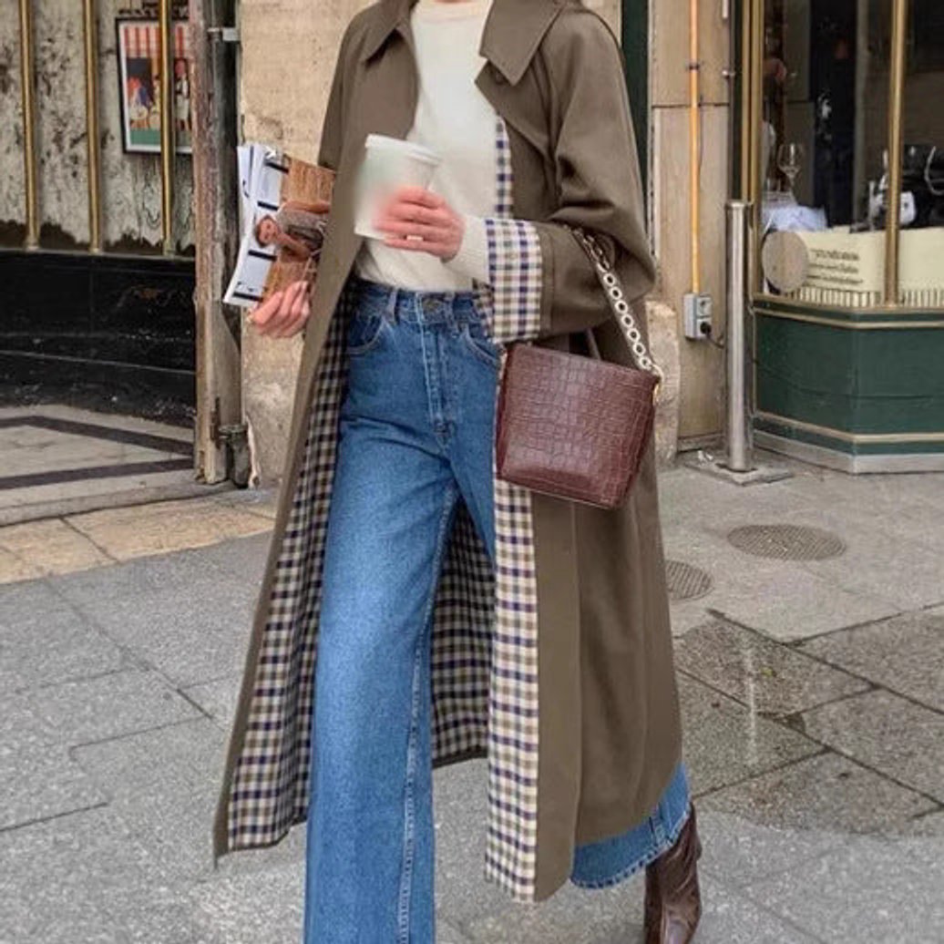 Women's oversized trench coat with plaid lining by Christine Brewer, featuring a long, stylish design perfect for layered winter looks.