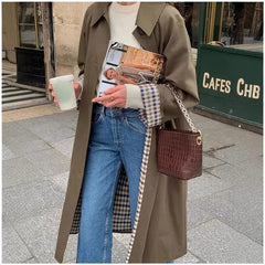 Women's oversized long trench coat with plaid lining by Christine Brewer, featuring a stylish, relaxed fit and classic design.