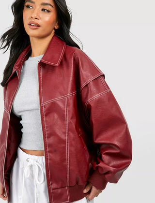 Women's oversized quilted bomber jacket with contrast stitching by Christine Brewer, featuring a relaxed fit and stylish design.