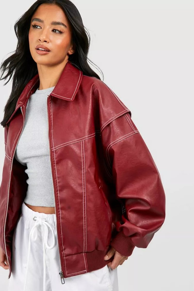 Women’s oversized quilted bomber jacket with contrast stitching, featuring a relaxed fit and stylish design by Christine Brewer.