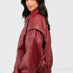 Women's oversized quilted bomber jacket with contrast stitching by Christine Brewer, featuring a stylish, chunky design and cozy fit.