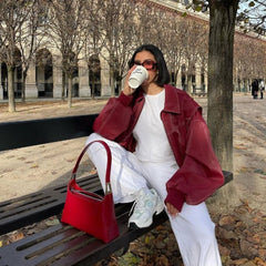 Women’s oversized quilted bomber jacket with contrast stitching by Christine Brewer, featuring a relaxed fit and stylish design.