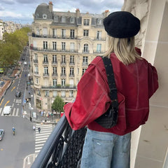 Women's oversized quilted jacket with contrast stitch details, bomber style by Christine Brewer, featuring a relaxed fit and textured fabric.