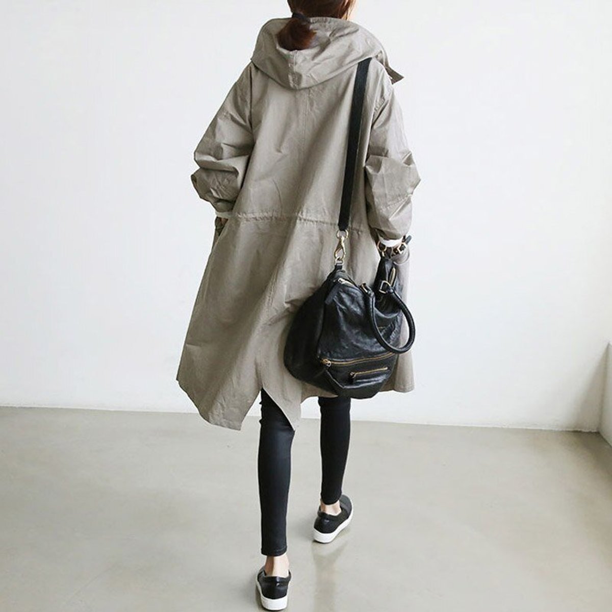 Women's oversized water-resistant trench coat with button-front design from Christine Brewer, shown in a stylish, relaxed fit.