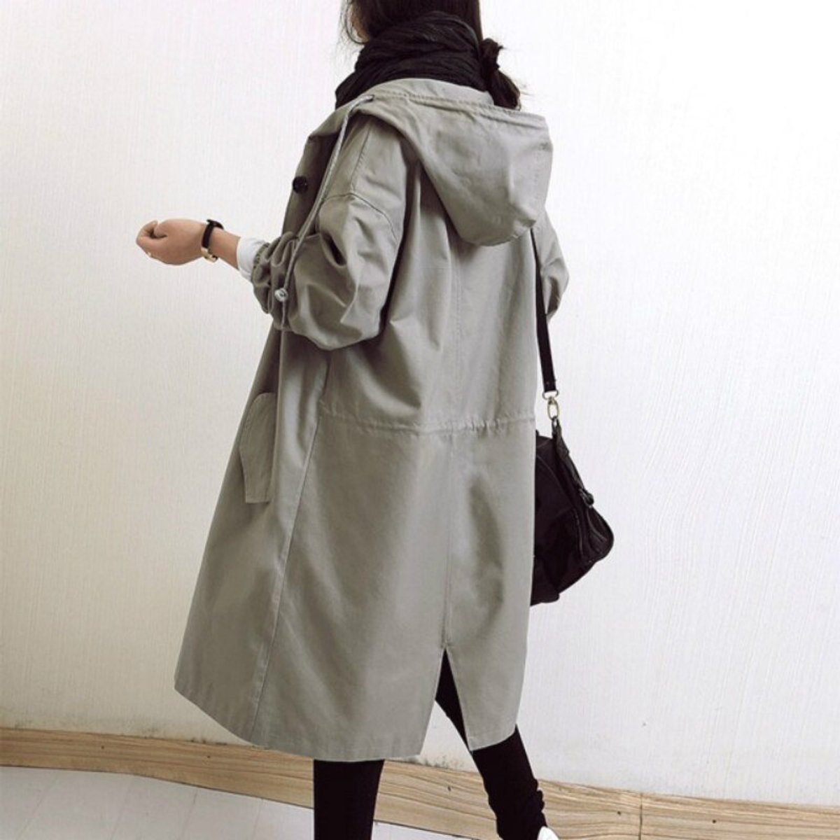 Women's oversized water-resistant trench coat by Christine Brewer with button-front design, shown in a stylish, relaxed fit.