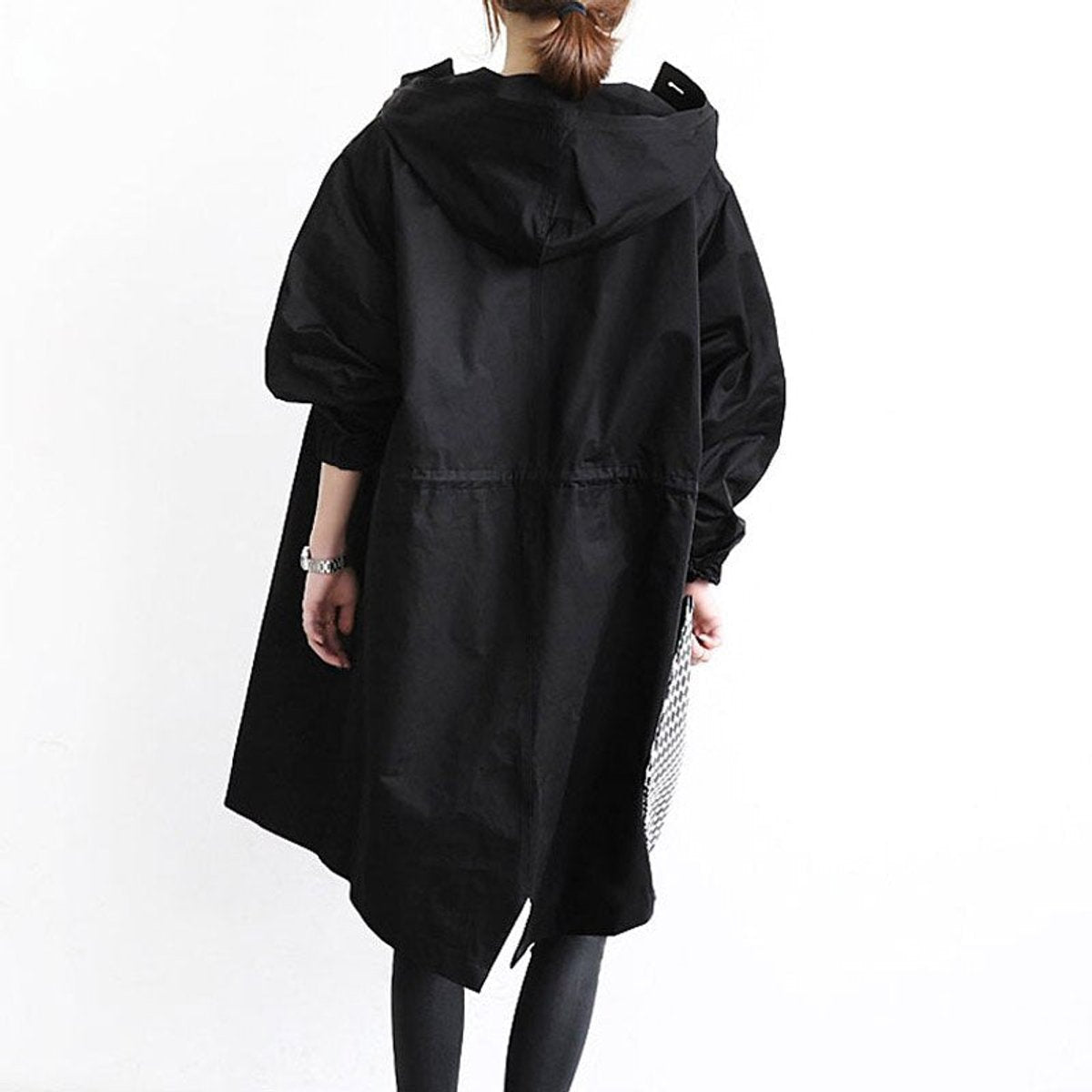 Women's oversized water-resistant trench coat with button-front closure by Christine Brewer, shown in a stylish, relaxed fit.