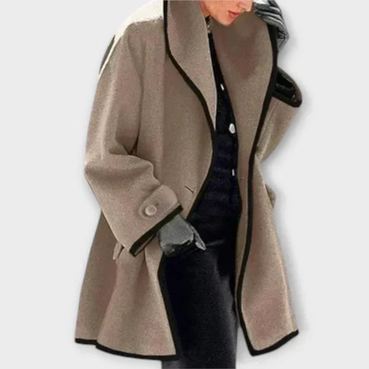 Black women's oversized wool-blend swing coat with contrast trim, designed by Christine Brewer.