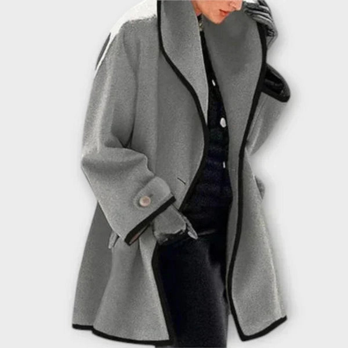 Black oversized wool-blend swing coat for women with contrast trim by Christine Brewer, shown on a model.