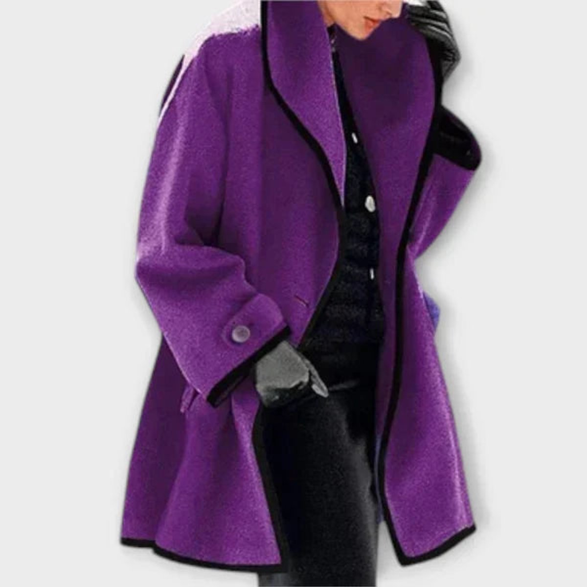Women’s oversized black wool-blend swing coat with contrast trim by Christine Brewer, shown on a model.