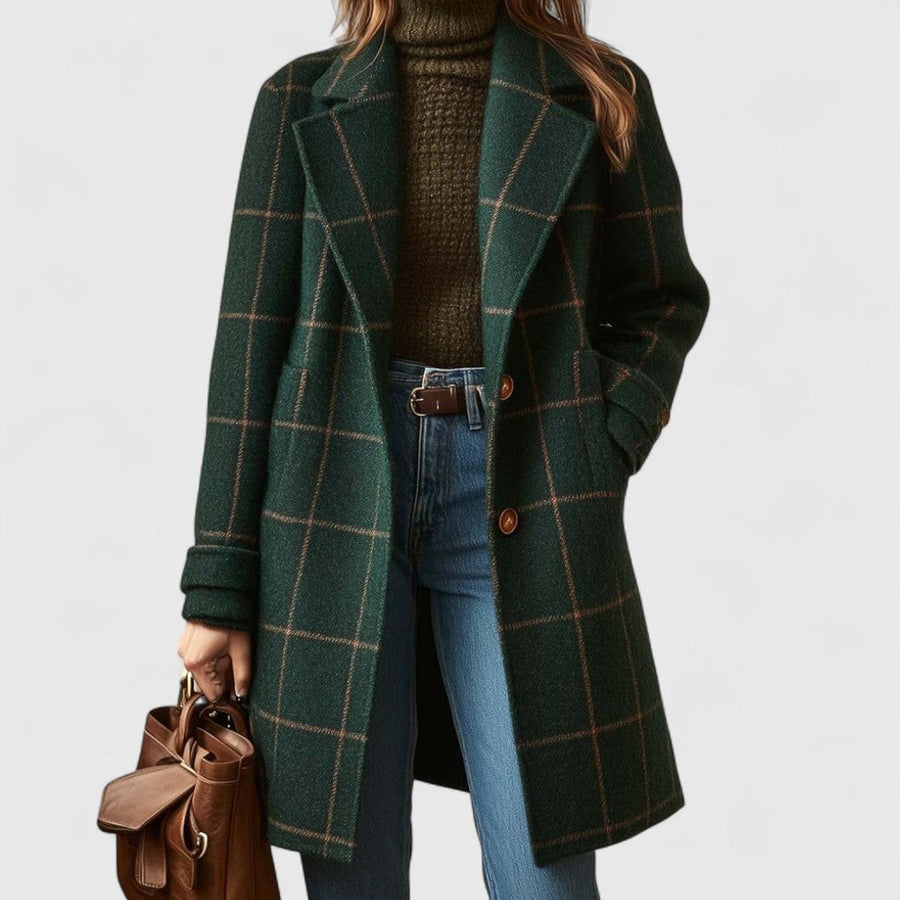Women's plaid wool-blend longline coat with notch lapel, stylishly displayed on a hanger, showcasing its classic pattern and tailored fit.