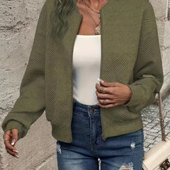 Women's quilted zip-up bomber jacket by Christine Brewer, textured cropped design with quilted detailing and modern style.