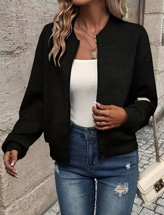 Women's quilted zip-up bomber jacket by Christine Brewer, textured cropped design with quilted stitching and stylish fit.