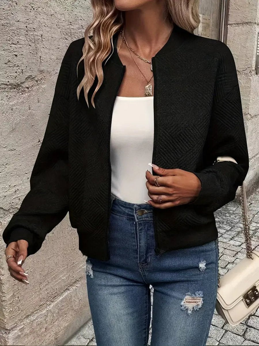 Women's quilted zip-up bomber jacket by Christine Brewer, textured cropped design with quilted stitching and stylish fit.