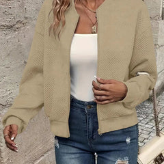 Emma women's quilted zip-up bomber jacket by Christine Brewer, textured cropped design with a stylish and cozy look.