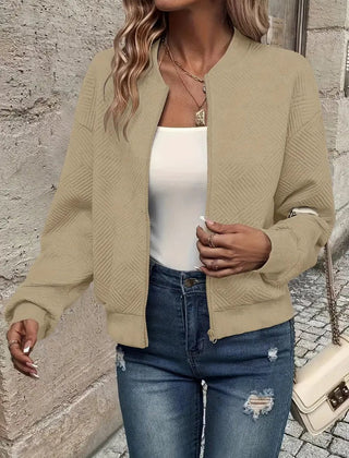 Emma women's quilted zip-up bomber jacket by Christine Brewer, textured cropped design with a stylish and cozy look.