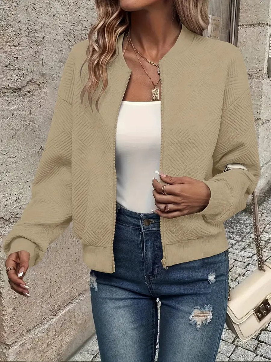 Emma women's quilted zip-up bomber jacket by Christine Brewer, textured cropped design with a stylish and cozy look.