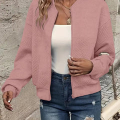 Textured pink Emma women's quilted zip-up bomber jacket by Christine Brewer, cropped style with a quilted pattern.