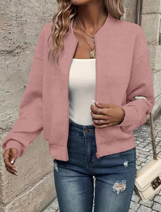 Textured pink Emma women's quilted zip-up bomber jacket by Christine Brewer, cropped style with a quilted pattern.