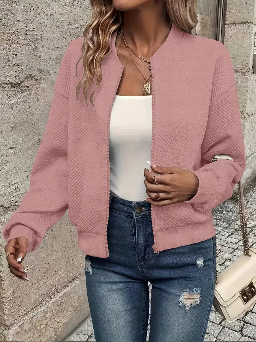 Textured pink Emma women's quilted zip-up bomber jacket by Christine Brewer, cropped style with a quilted pattern.