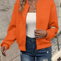 Women's quilted zip-up bomber jacket by Christine Brewer, textured cropped design with quilted detailing and a stylish fit.