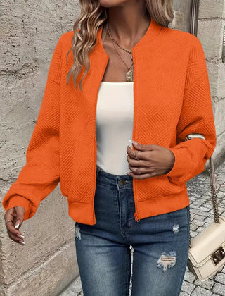 Women's quilted zip-up bomber jacket by Christine Brewer, textured cropped design with quilted detailing and a stylish fit.