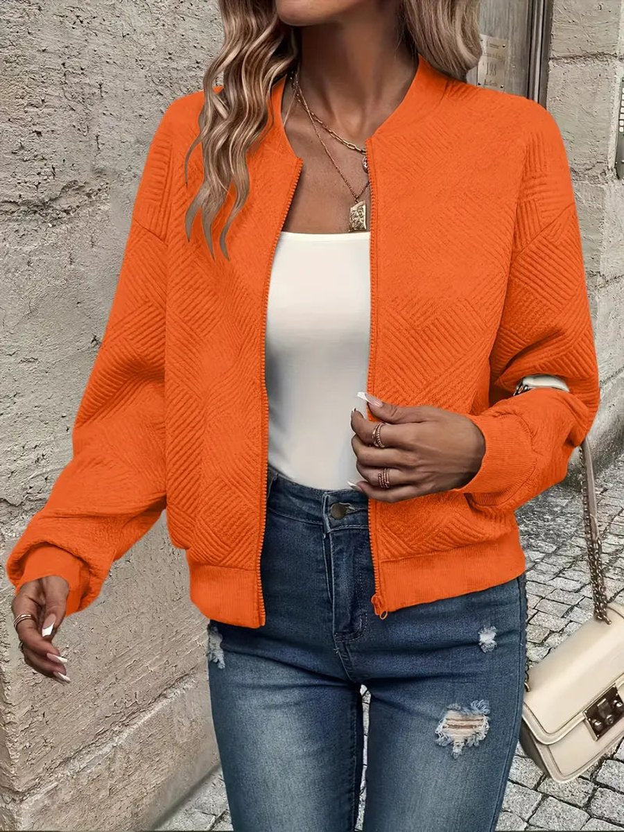 Women's quilted zip-up bomber jacket by Christine Brewer, textured cropped design with quilted detailing and a stylish fit.