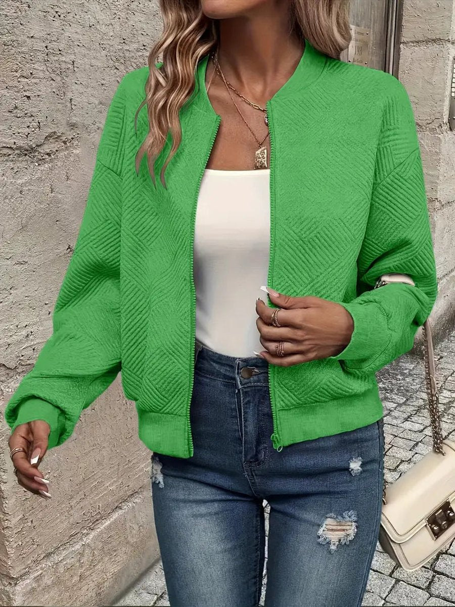 Women's quilted zip-up bomber jacket by Christine Brewer featuring textured, cropped design and stylish quilting details.