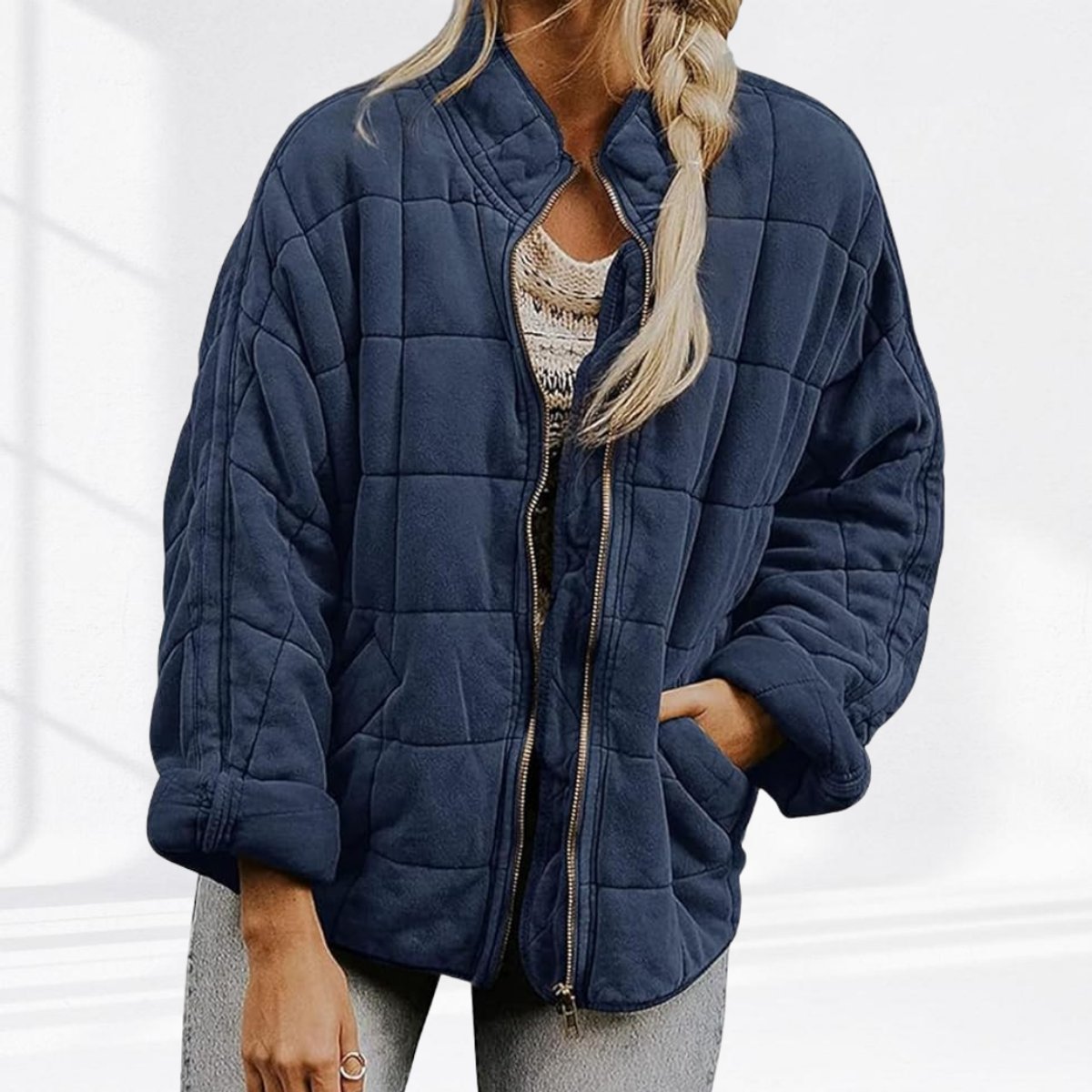 Women's relaxed-fit diamond quilted zip-up jacket by Christine Brewer, showing the casual jacket with front zipper and quilted texture.
