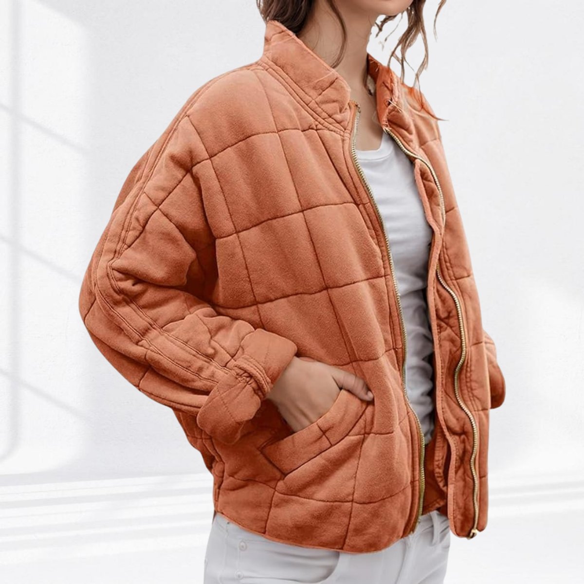 Women's relaxed-fit diamond quilted zip-up jacket by Christine Brewer, casual wear with a stylish quilted pattern.