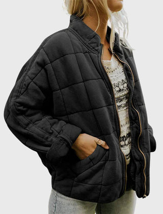 Women's relaxed-fit diamond quilted zip-up jacket by Christine Brewer, shown in a casual style with a front zipper and quilted pattern.