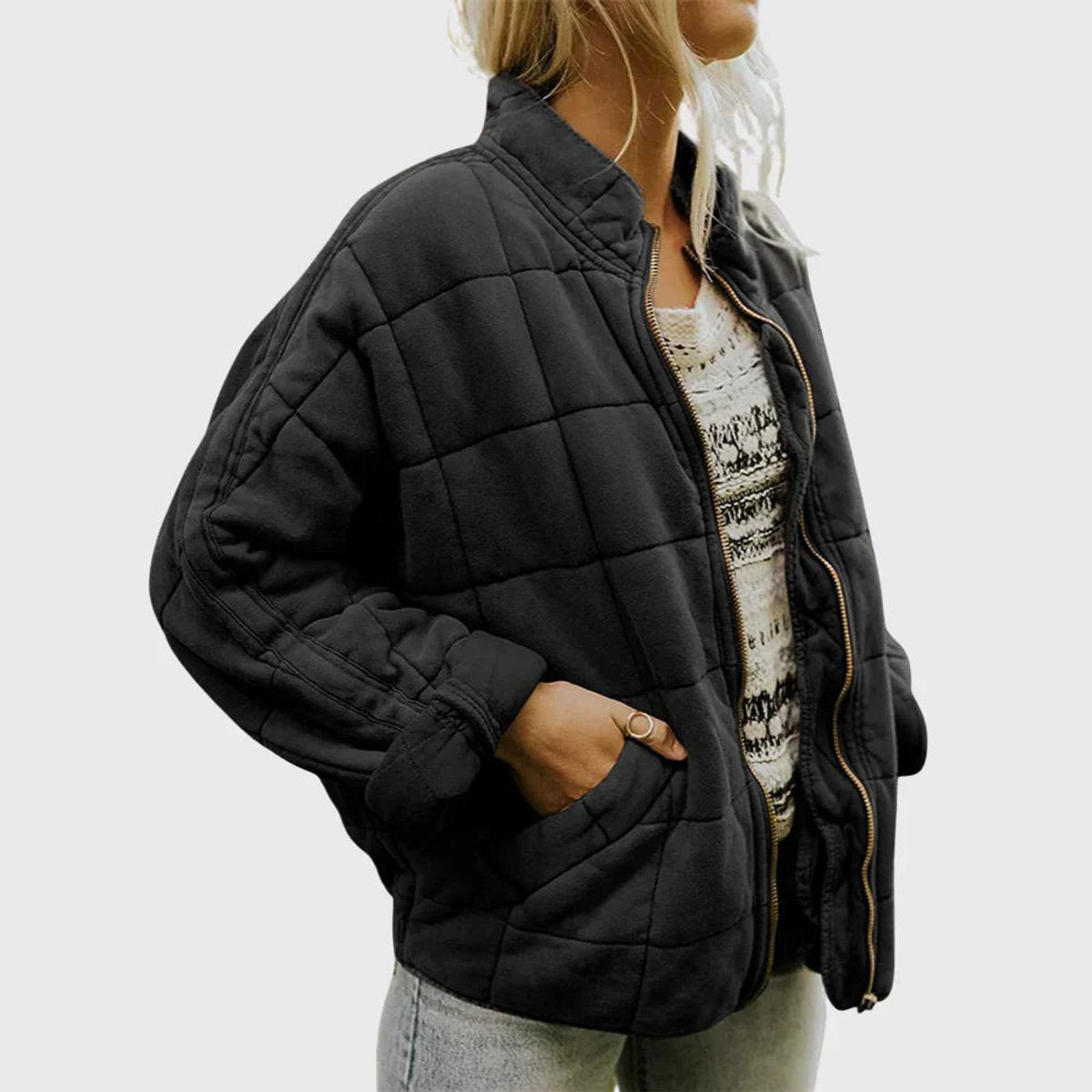 Women's relaxed-fit diamond quilted zip-up jacket by Christine Brewer, shown in a casual style with a front zipper and quilted pattern.