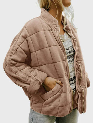 Women's relaxed-fit diamond quilted zip-up jacket by Christine Brewer, shown in a casual style with a front zipper and quilted pattern.