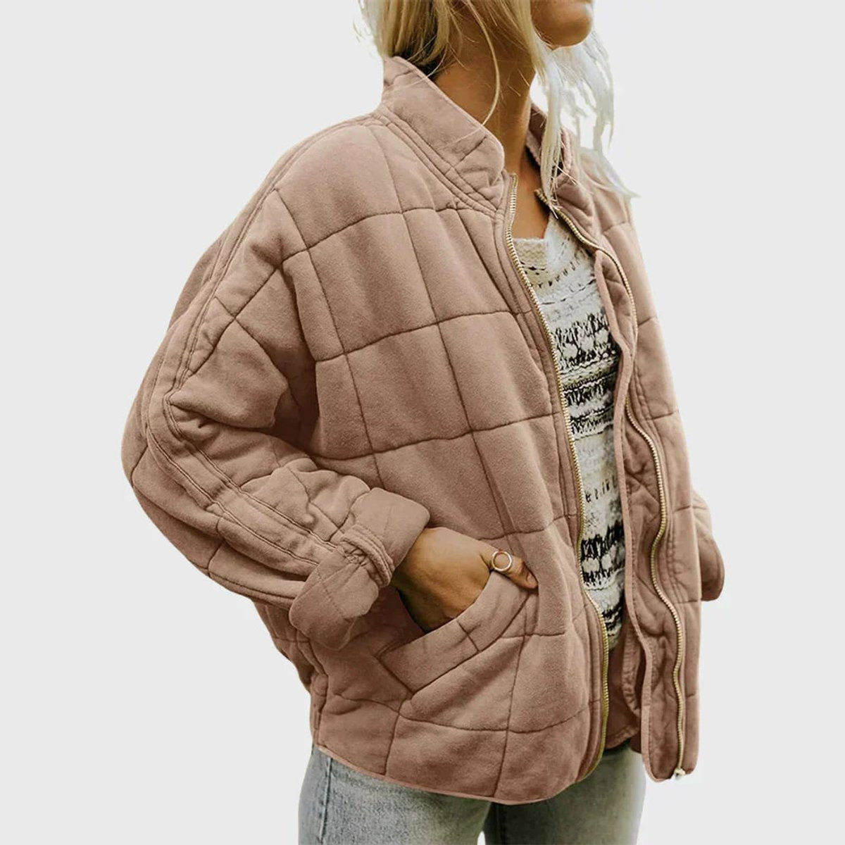 Women's relaxed-fit diamond quilted zip-up jacket by Christine Brewer, shown in a casual style with a front zipper and quilted pattern.
