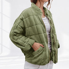 Women's relaxed-fit diamond quilted zip-up jacket by Christine Brewer, showing the casual style and textured diamond quilting.