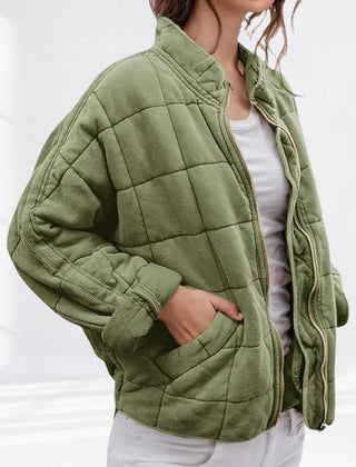 Women's relaxed-fit diamond quilted zip-up jacket by Christine Brewer, showing the casual style and textured diamond quilting.