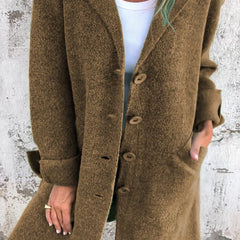 Women's relaxed-fit long button-front lapel coat by Christine Brewer, casual style, shown on a model with pockets and lapel collar.