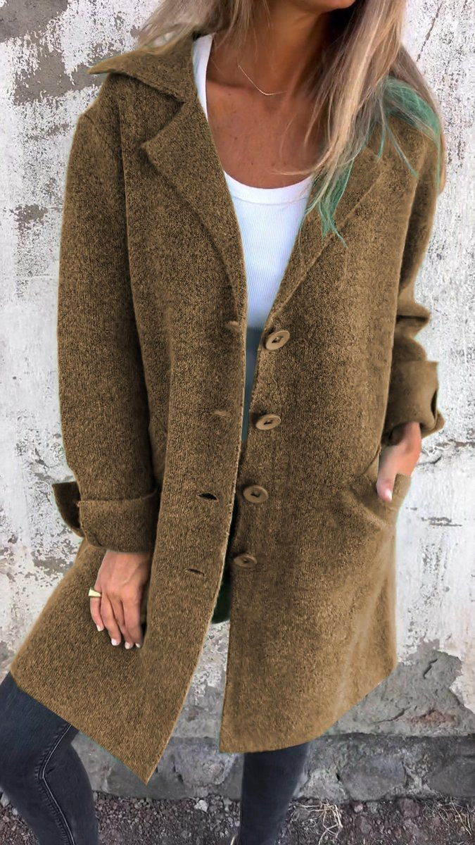 Women's relaxed-fit long button-front lapel coat by Christine Brewer, casual style, shown on a model with pockets and lapel collar.
