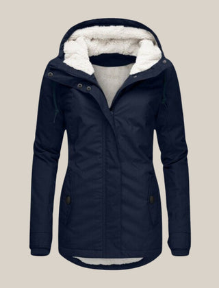 Women’s Sherpa-lined quilted winter jacket with hood by Christine Brewer, featuring cozy fleece lining and quilted design.