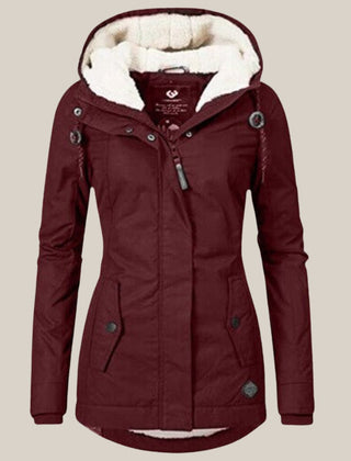 Women’s Sherpa-lined quilted winter jacket with hood, fleece interior, and quilted exterior by Christine Brewer.