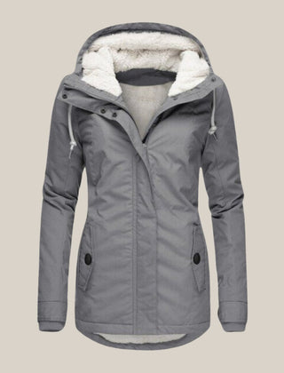 Women’s Sherpa-lined quilted winter jacket with hood, fleece interior, and quilted design by Christine Brewer.