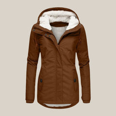 Women's Sherpa-lined quilted winter jacket with hood by Christine Brewer, featuring cozy fleece lining and quilted design.