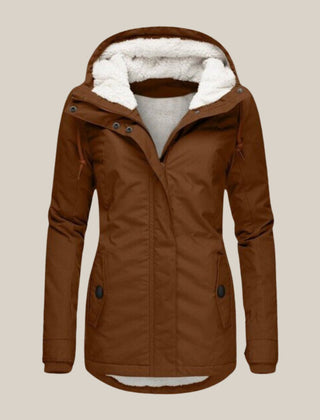 Women's Sherpa-lined quilted winter jacket with hood by Christine Brewer, featuring cozy fleece lining and quilted design.