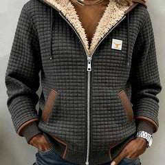 Women's Sherpa-lined quilted jacket with full-zip, hood, and fleece from Christine Brewer, featuring a cozy, stylish winter design.