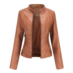 Women's short-cut faux leather moto jacket with mock-neck and zip-up front by Christine Brewer, styled for a chic look.