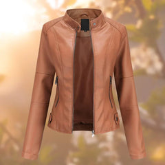 Women’s slim-fit zip-up faux leather moto jacket by Christine Brewer, featuring a sleek design and classic collar detail.