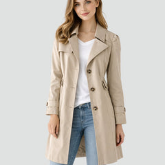 Women’s tailored mid-length double-breasted trench coat by Christine Brewer, featuring classic design and belt detail.