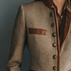 Sophia women's vintage herringbone tweed jacket with leather trim and button front by Christine Brewer, shown in natural fabric detail.