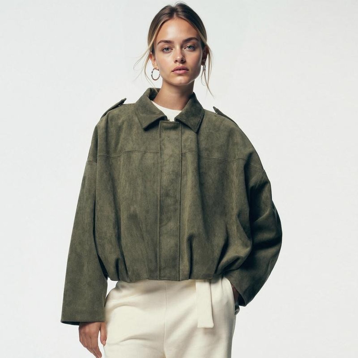 Women's vintage-inspired faux suede oversized bomber jacket by Christine Brewer, shown in a stylish, relaxed fit design.