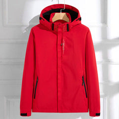 Women's waterproof hooded rain jacket by Christine Brewer with adjustable fit, featuring a hood and stylish rain-resistant design.